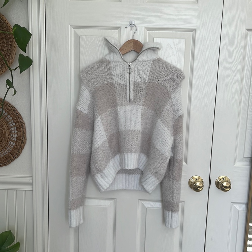 Knit sweater with turtle neck.  Furry and comfortable. Has zipper
